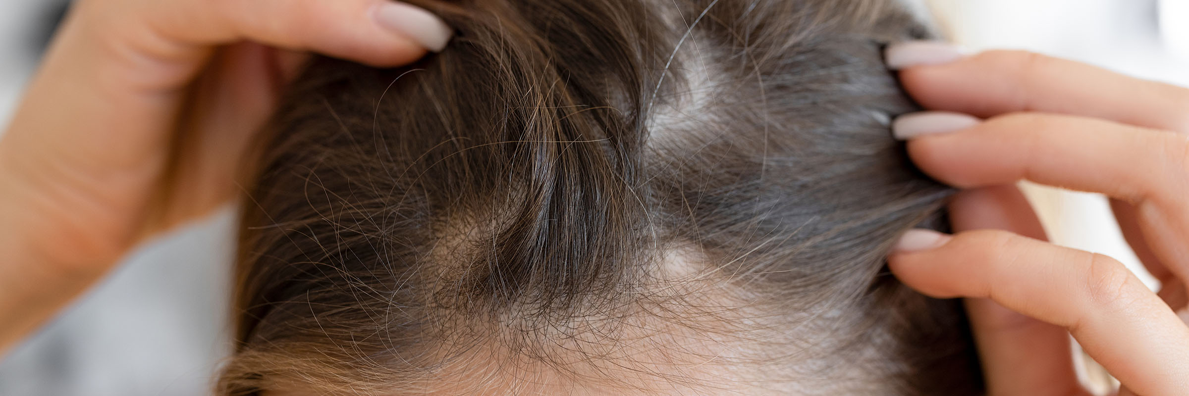Touching up grey roots with colour